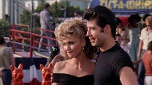 Scene uit film Grease met Olivia Newton John en John Travolta